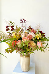 An example of Floral Arrangement Dusk from Sprout Home sits in a vase against a white backdrop