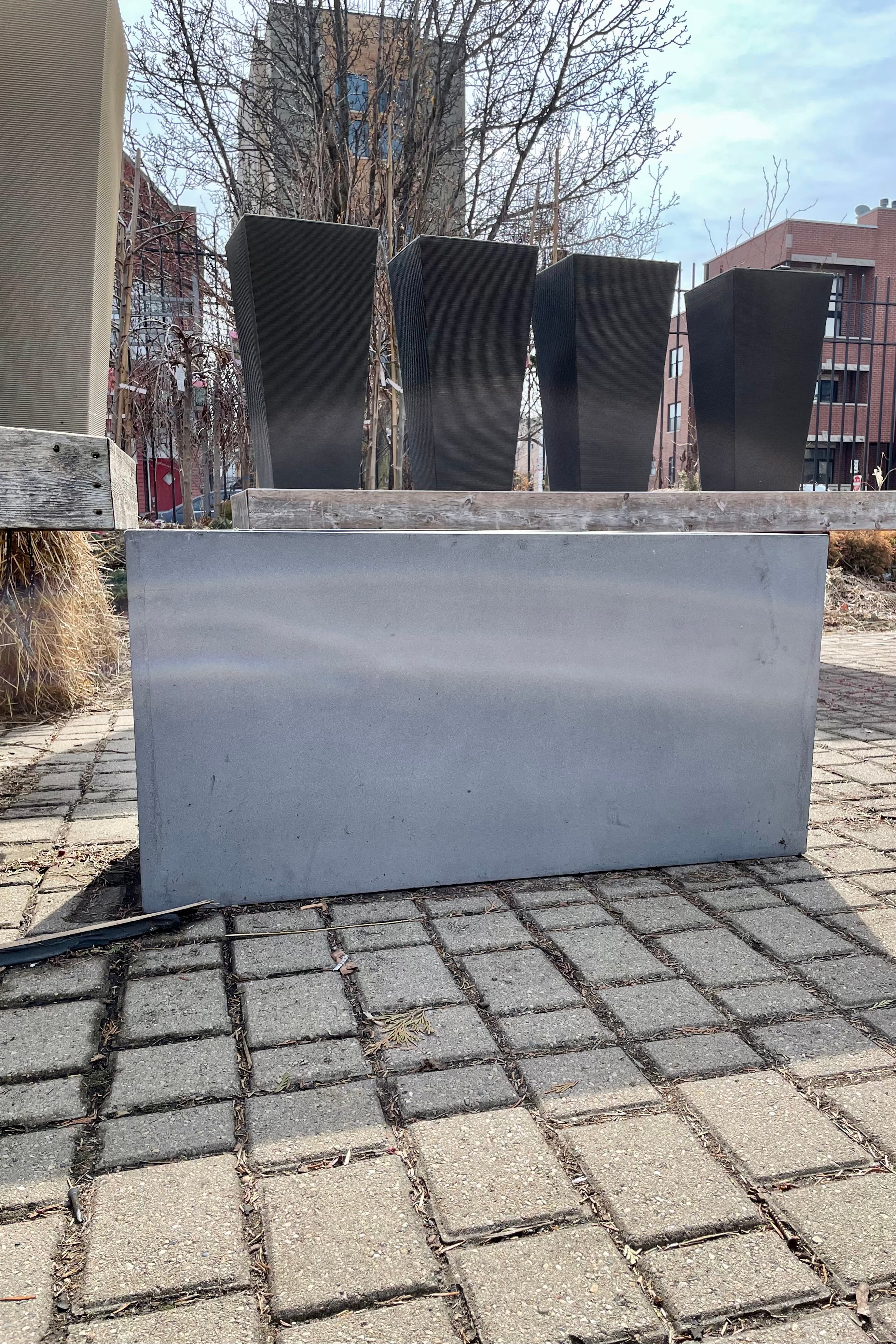 The fiberstone Jort medium grey planter in the Sprout Home Yard.