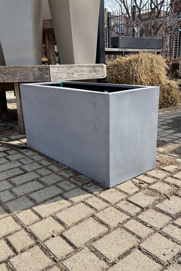 The fiberstone Jort medium grey planter in the Sprout Home Yard.