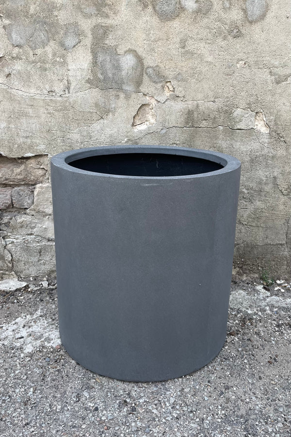 Max Pot Matte Grey Medium straight on against a grey wall 