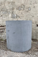 Max Pot Matte Grey Large against a grey wall
