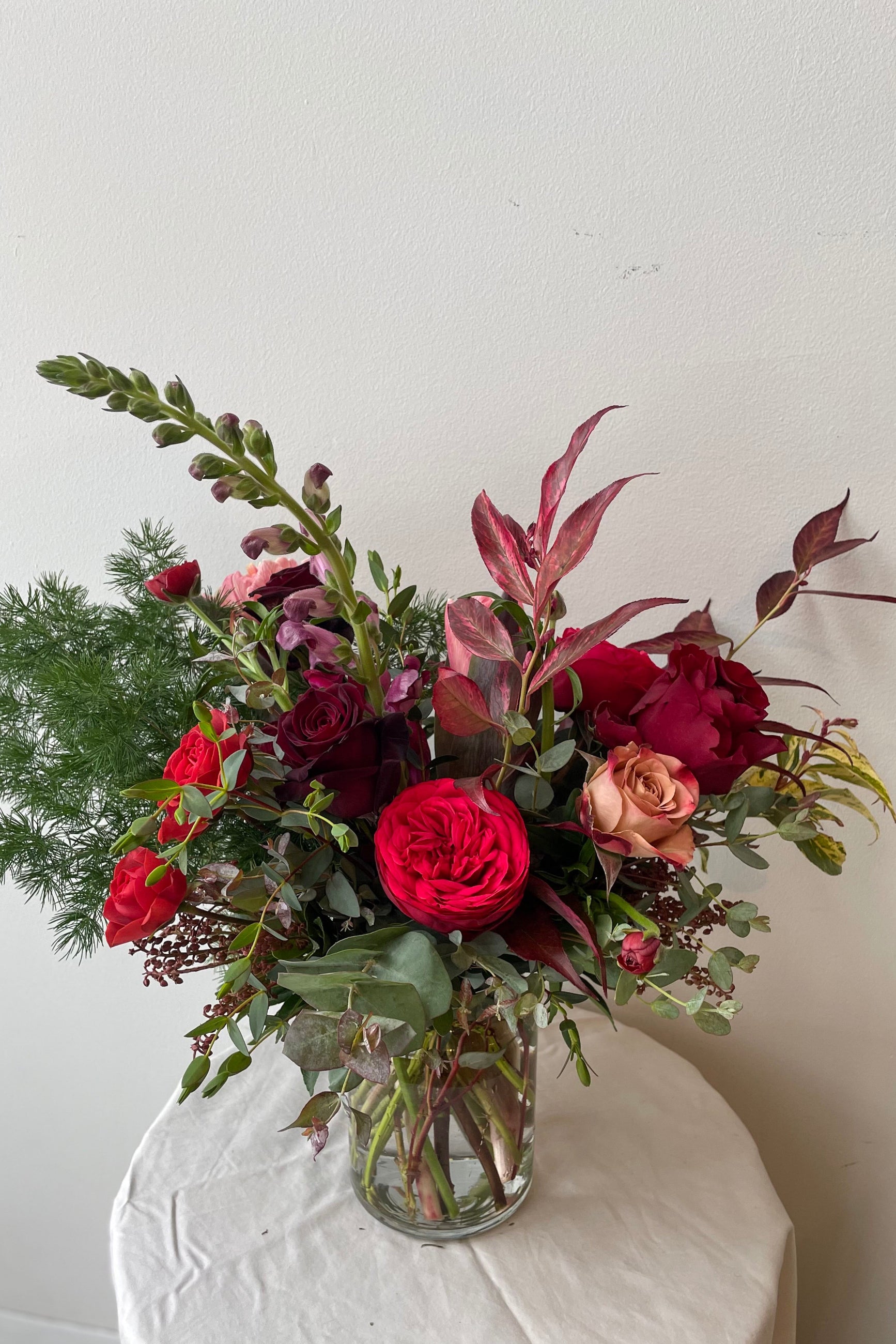 Sprout Home floral custom Earth arrangement featuring red roses ©Sprout Home #size_$75