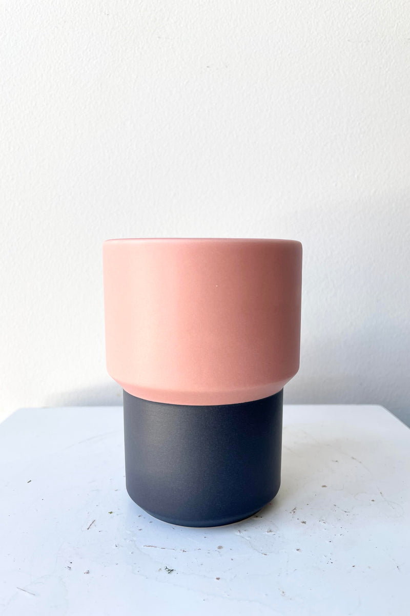 The Fumario Ceramic Cup - Pink & Dark Grey sits against a white backdrop.