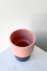 An overhead shots of the Fumario Ceramic Cup - Pink & Dark Grey.