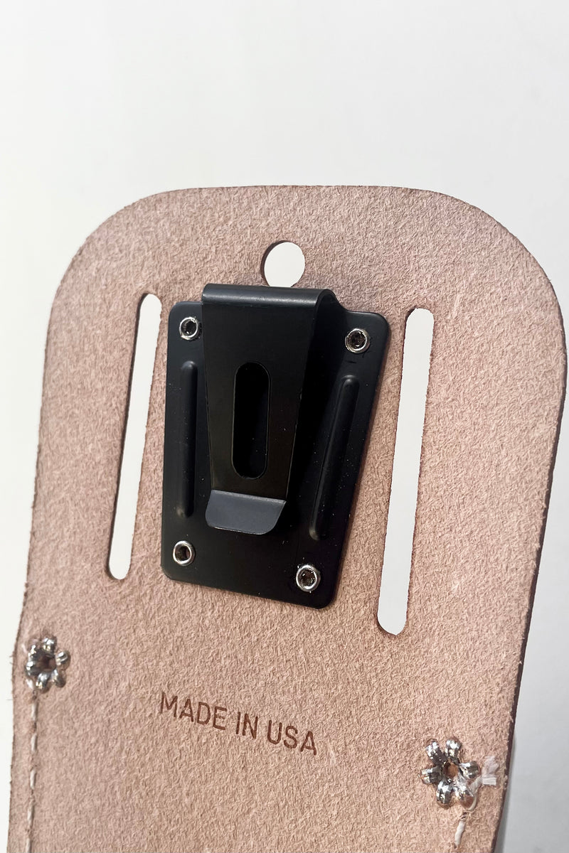 A detailed view of the back holster clip of Felco Belt Clip Holster against white backdrop