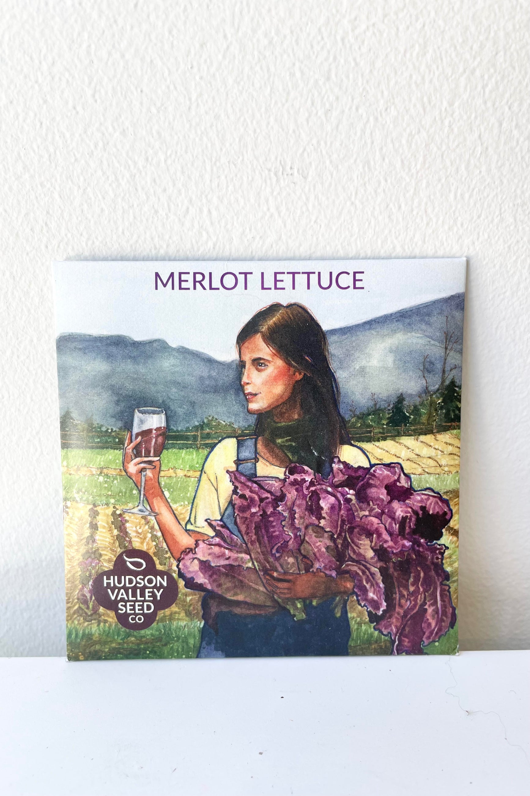 A detailed look at the packaging of the Merlot Lettuce Seeds Art Pack.. ©Sprout Home