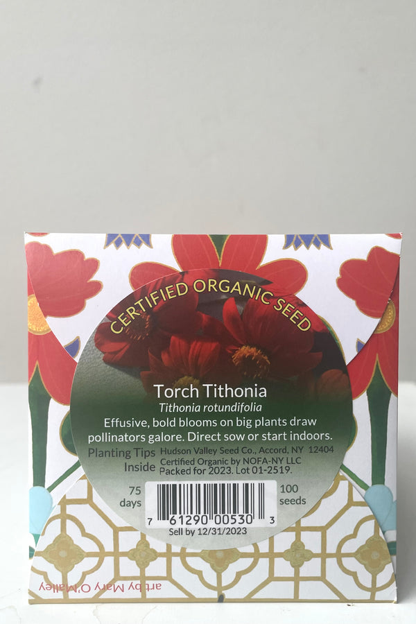 A view of the back of the Torch Tithonia Seeds Art Pack against white backdrop