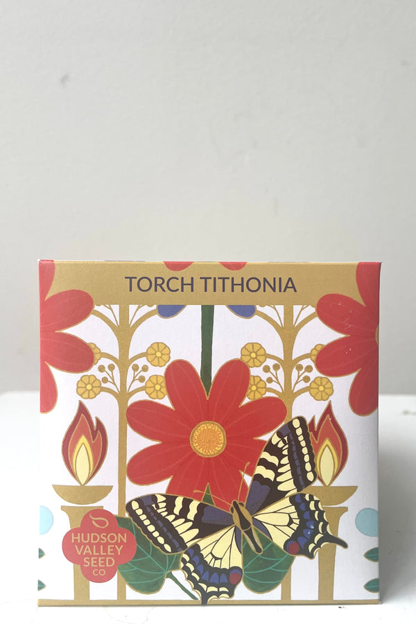 A frontal view of the Torch Tithonia Seeds Art Pack against a white backdrop