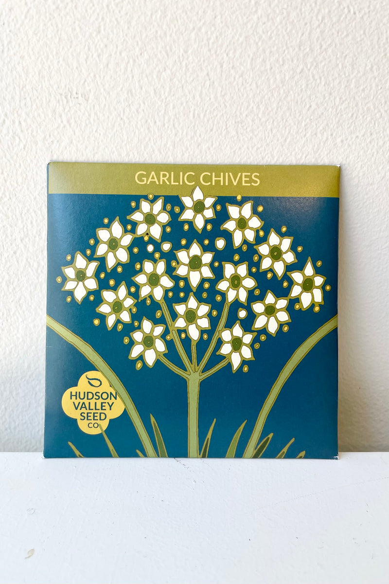 Garlic Chives art pack seeds against a white wall