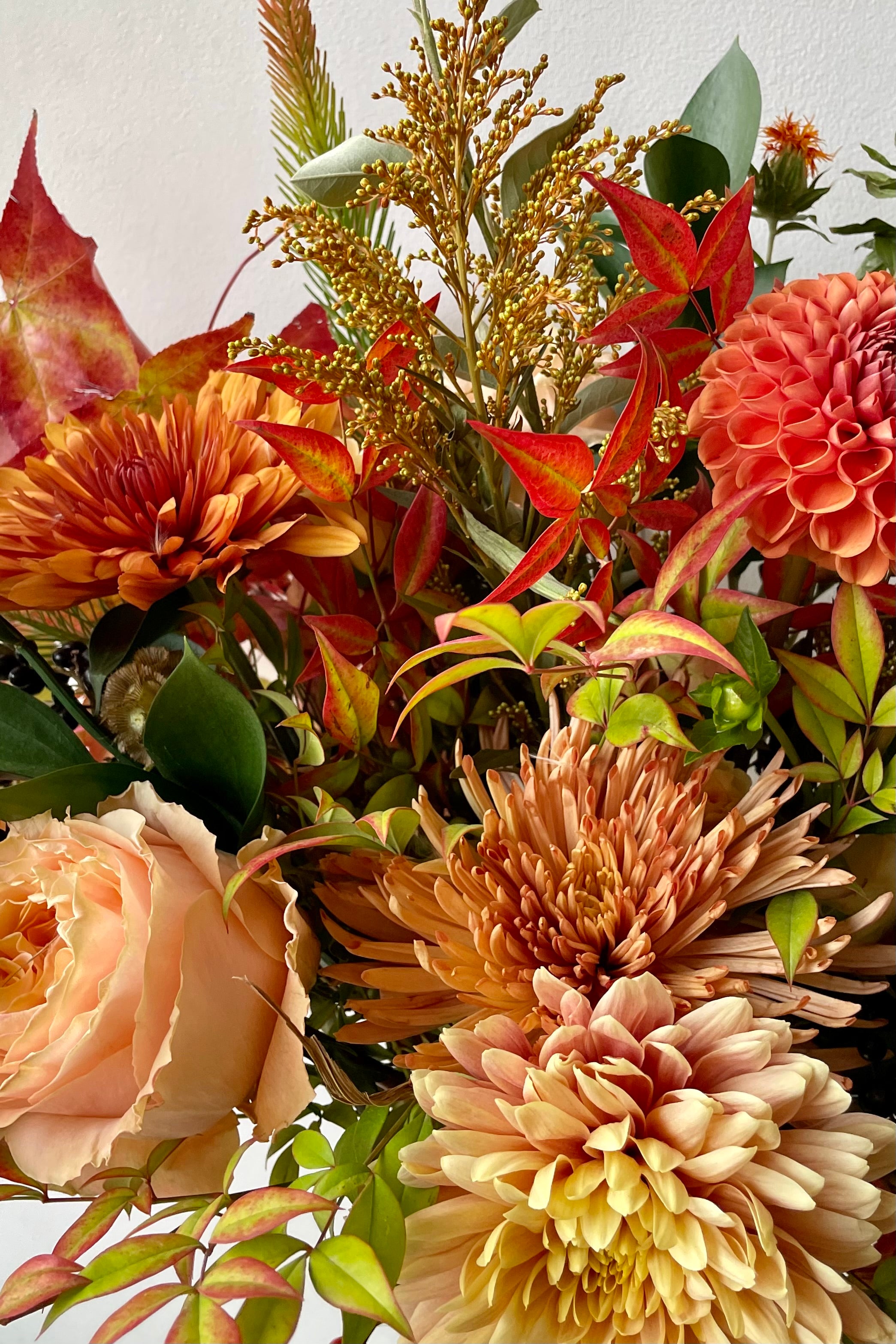 Detail harvest colors of fresh floral and greens in Sprout Home's Harvest Moon arrangement. #size_$125