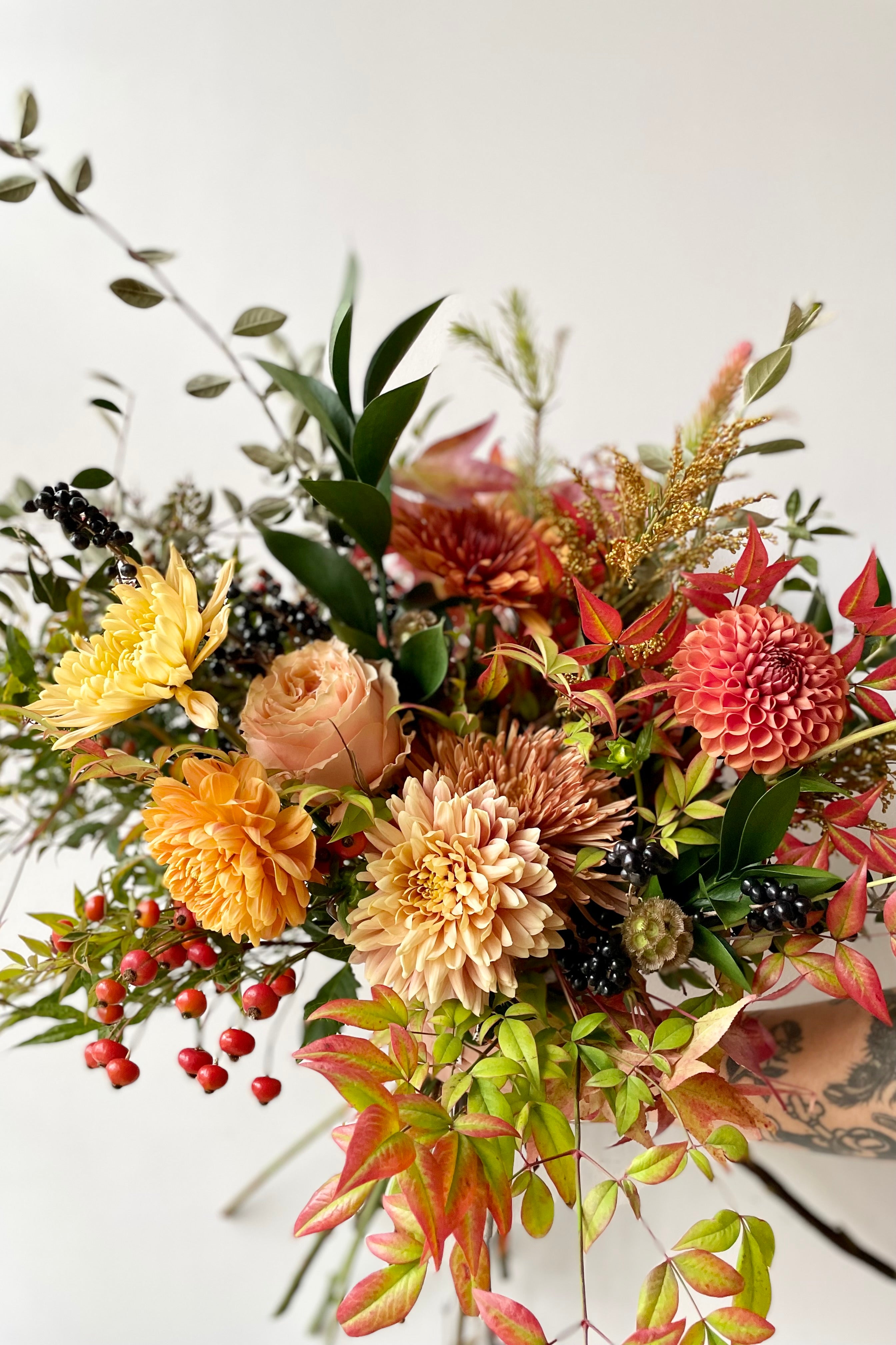 Harvest Moon arrangement by Sprout Home against a white wall. #size_$160