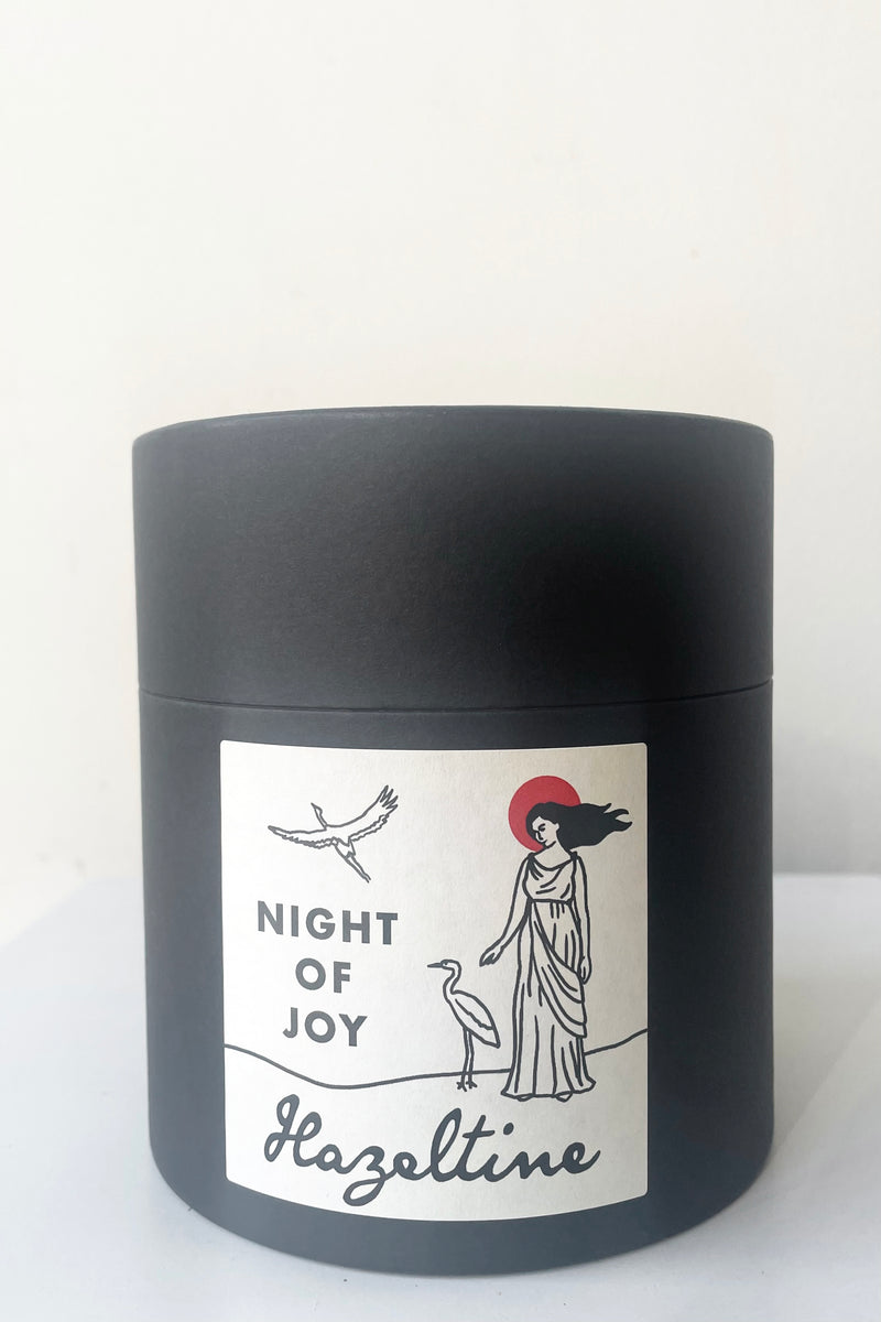 A view of the packaging of Hazeltine Candle night of joy against white backdrop