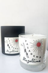 A view of the packaging and candle of Hazeltine Candle pasadena against white backdrop