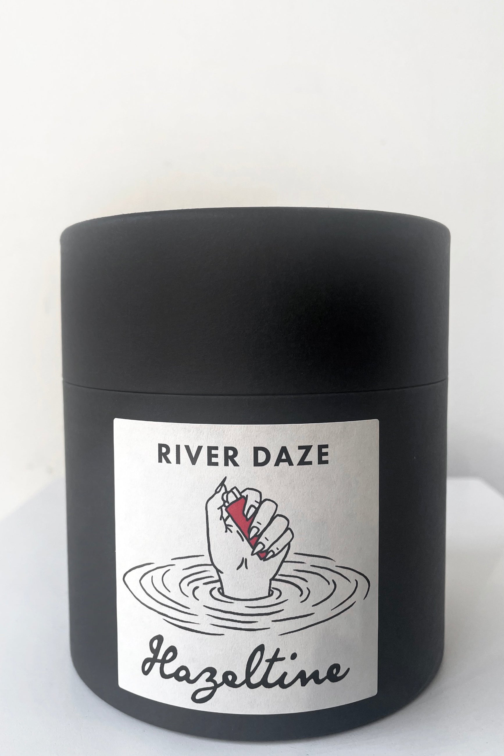 A full view of packaging of Hazeltine Candle river daze against white backdrop ©Sprout Home