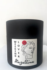A full view of packaging of Hazeltine Candle weekend lover against white backdrop