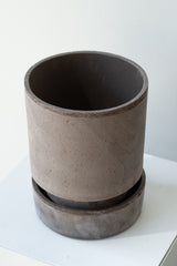 Grey 5.5 inch Hoff Pot by Bergs Potter on a white surface in a white room
