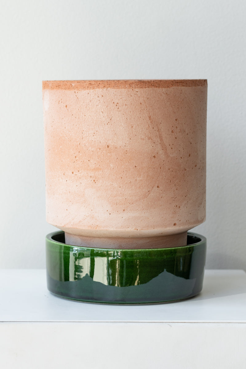 Rosa and emerald 5.5 inch Hoff Pot by Bergs Potter on a white surface in a white room