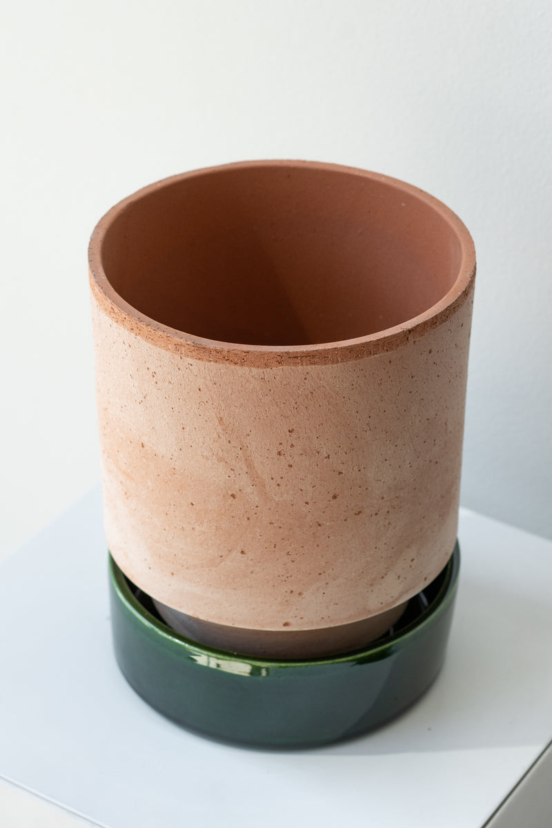 Rosa and emerald 5.5 inch Hoff Pot by Bergs Potter on a white surface in a white room
