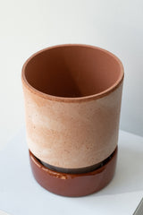 Rosa and red 5.5 inch Hoff Pot by Bergs Potter on a white surface in a white room