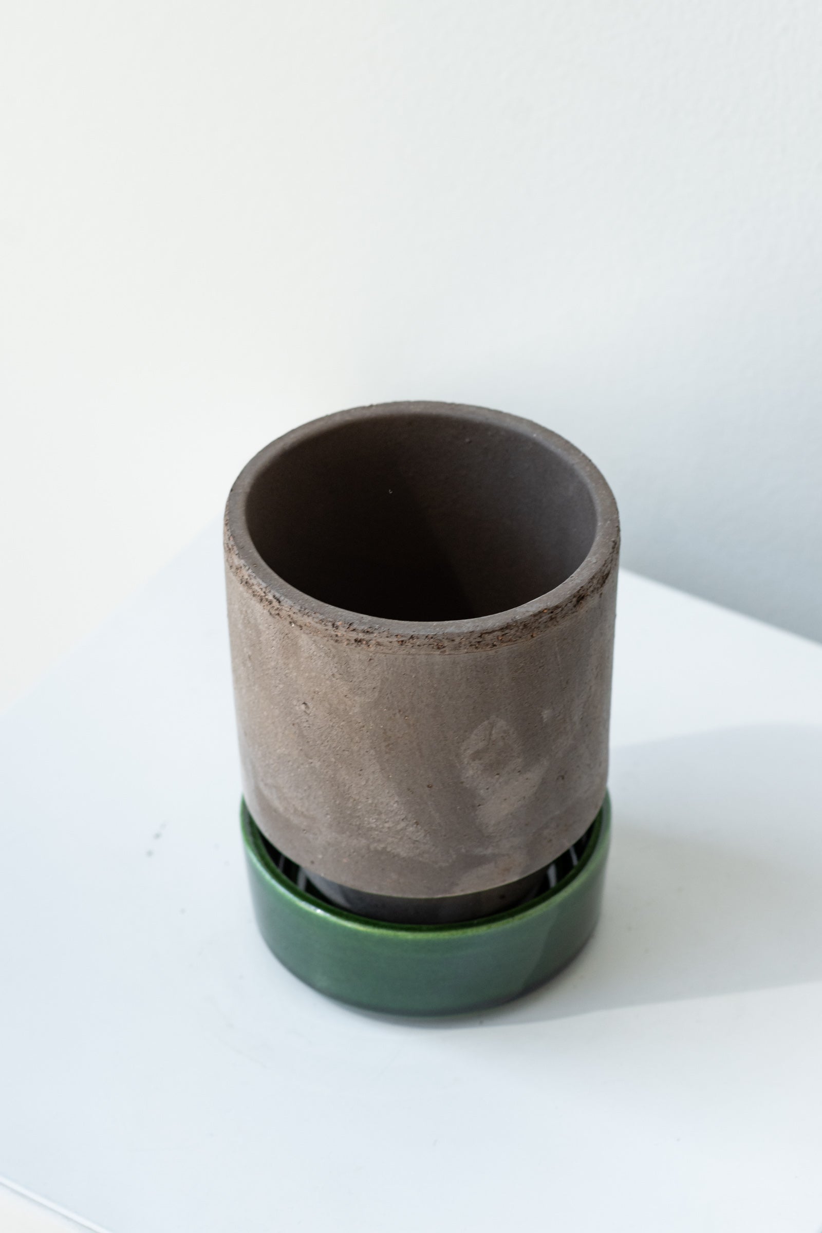 Grey and emerald 3.1 inch Hoff Pot by Bergs Potter on a white surface in a white room