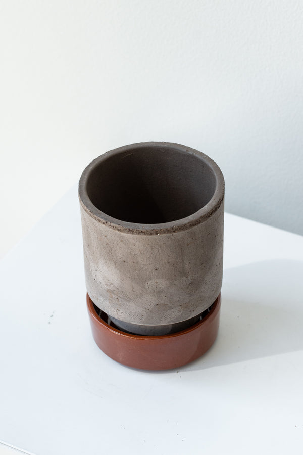 Grey and red 3.1 inch Hoff Pot by Bergs Potter on a white surface in a white room