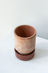 Rosa and red 3.1 inch Hoff Pot by Bergs Potter on a white surface in a white room