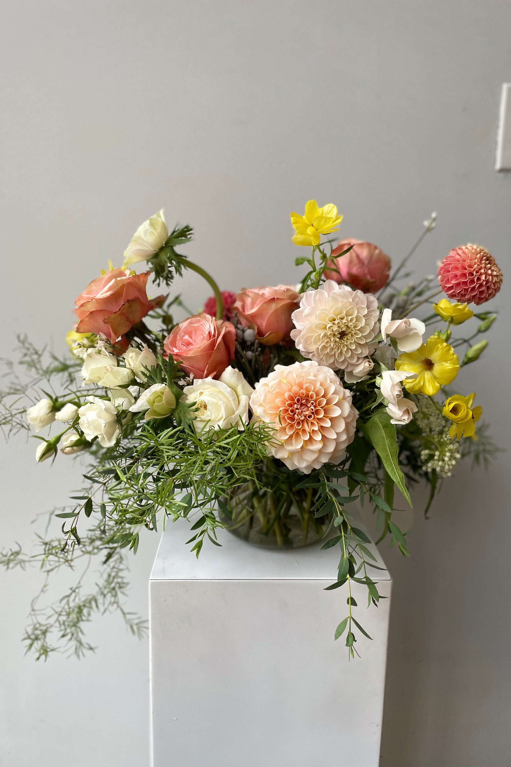 Floral arrangement by Sprout Home featuring dahlias in peach and cream tones ©Sprout Home #size_$100