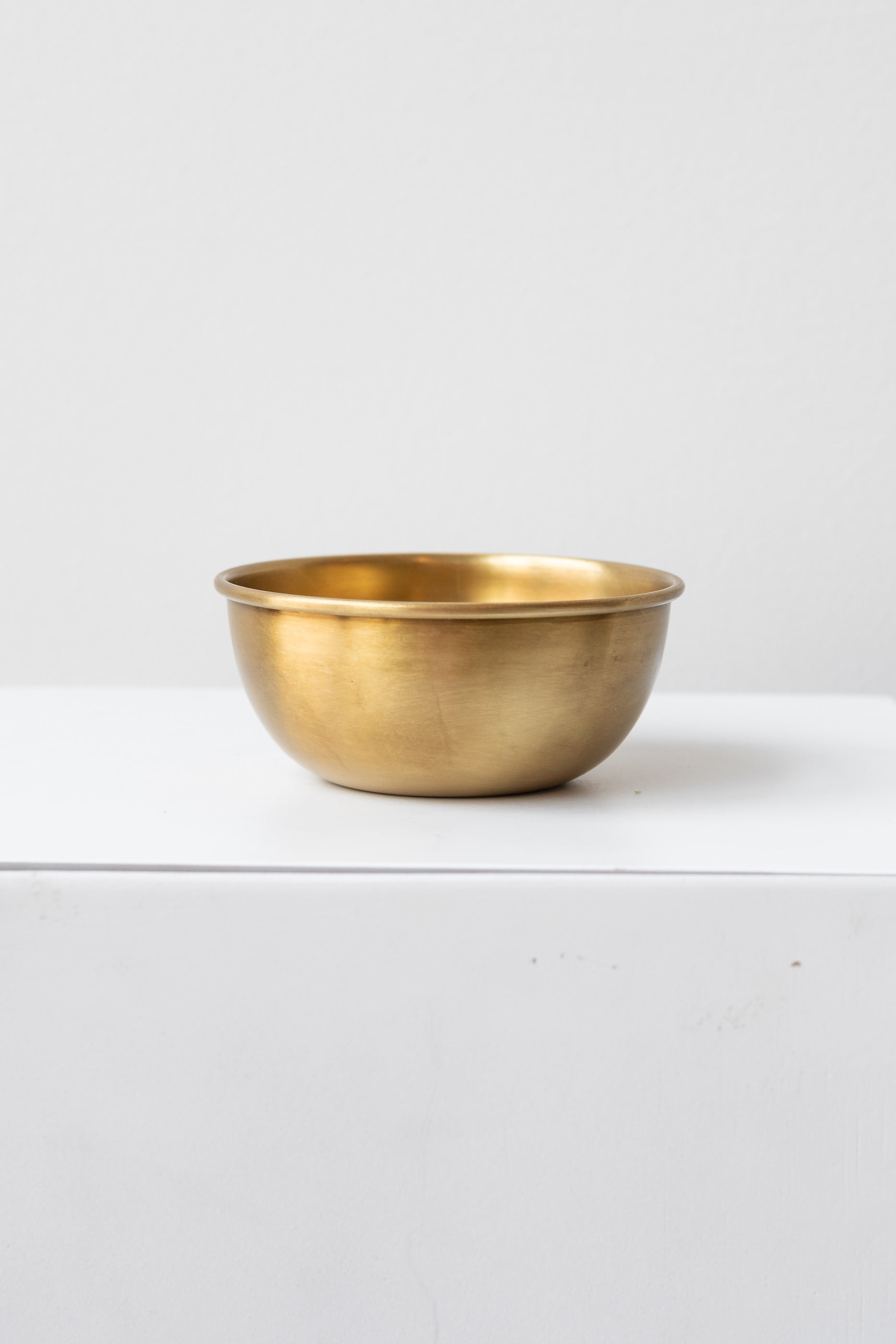 Fog Linen Work medium brass bowl on white surface in a white room