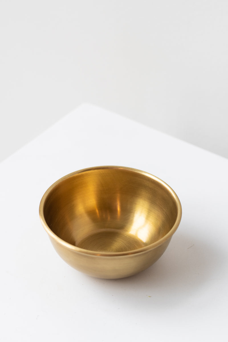Fog Linen Work small brass bowl on white surface in a white room