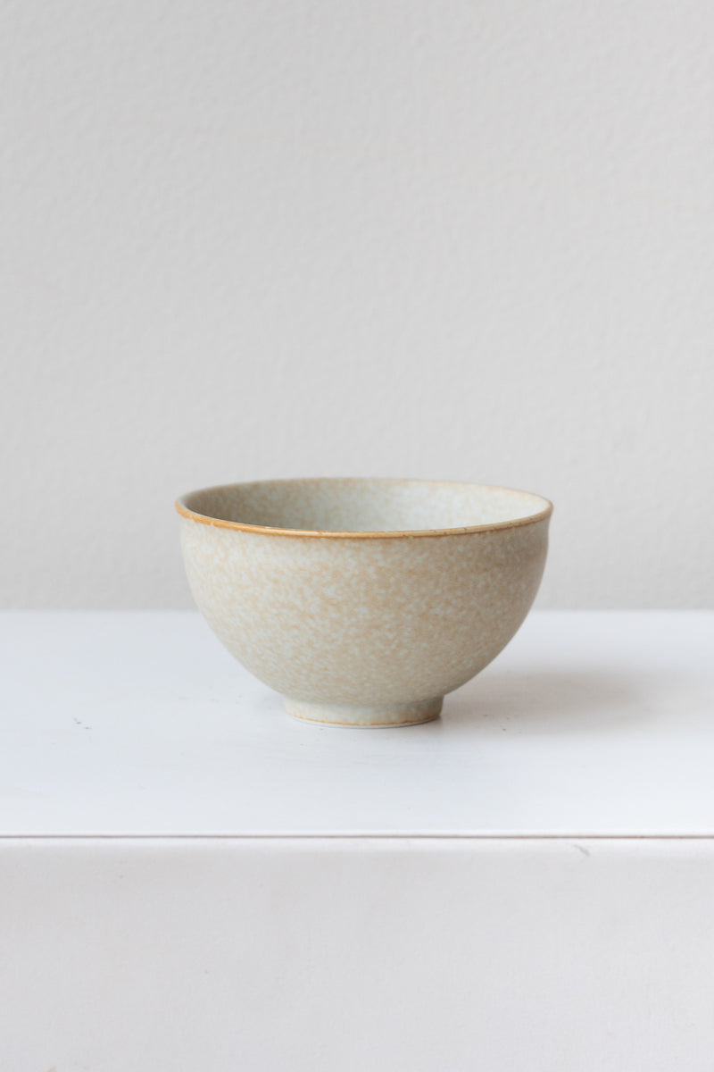 Grey Ishi Teacup by Miya Company Inc sits on a white surface in a white room