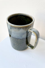 Mug green iraho mug detail of light blue, black and specks of yellow glaze