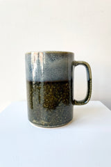 Mug green iraho mug with light blue, black and specks of yellow glaze
