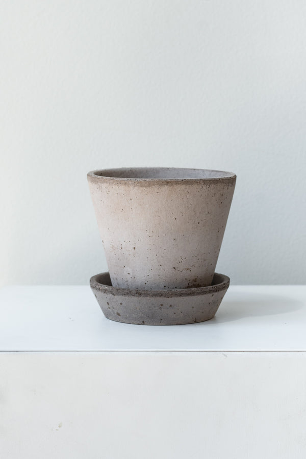 Grey 3.9 inch Julie Pot by Bergs Potter on a white surface in a white room