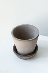 Grey 3.9 inch Julie Pot by Bergs Potter on a white surface in a white room
