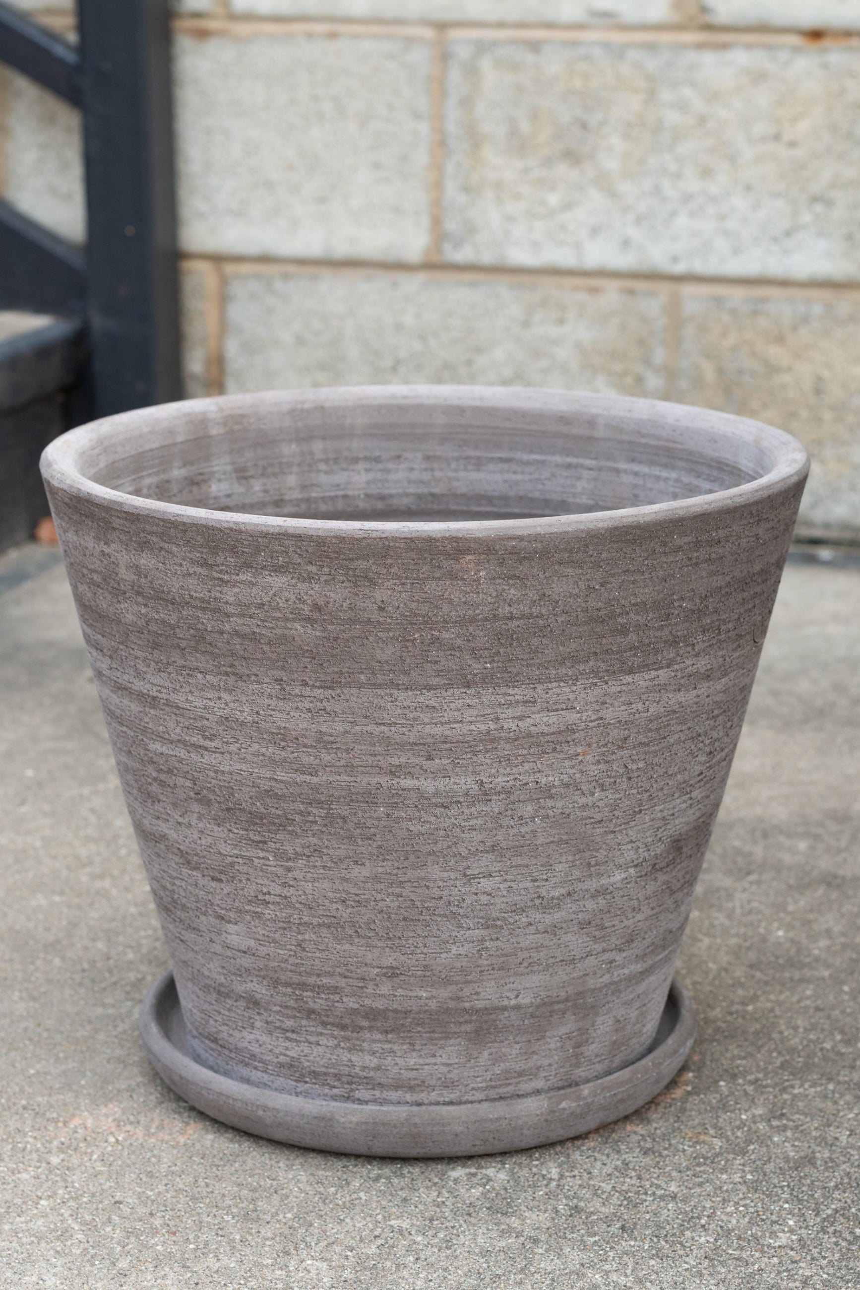 Bergs Potter Julie Pot & Saucer grey 13.8” in front of concrete brick wall ©Sprout Home