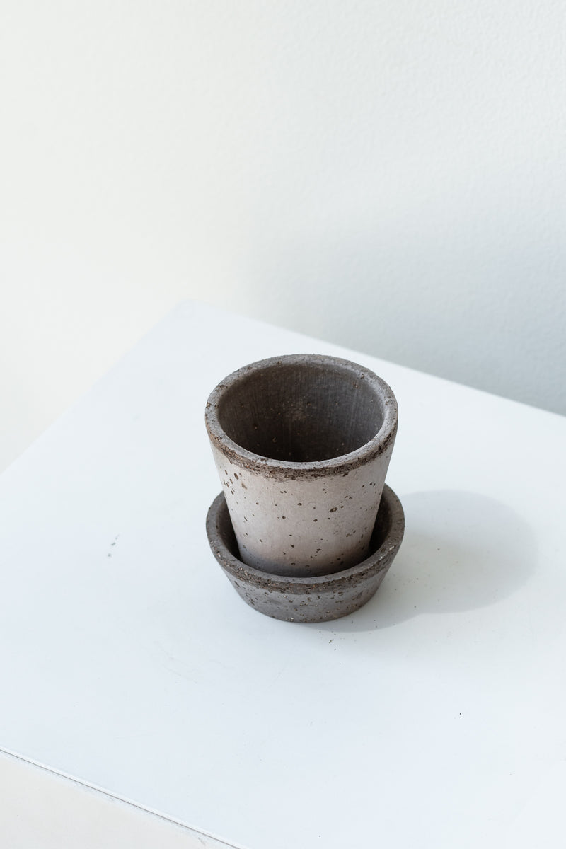 Grey 2.4 inch Julie Pot by Bergs Potter on a white surface in a white room