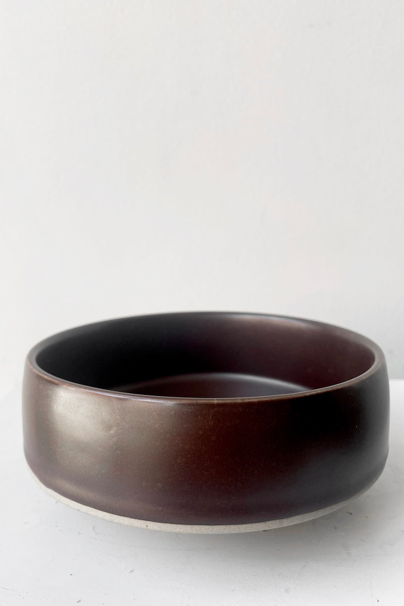 A frontal view of Hagi bowl brown small against white backdrop