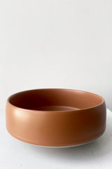 A full frontal view of Hagi bowl caramel small against white backdrop