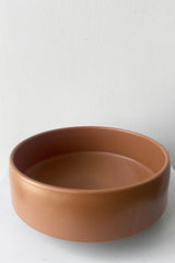 A slightly overhead view of Hagi bowl caramel medium against white backdrop