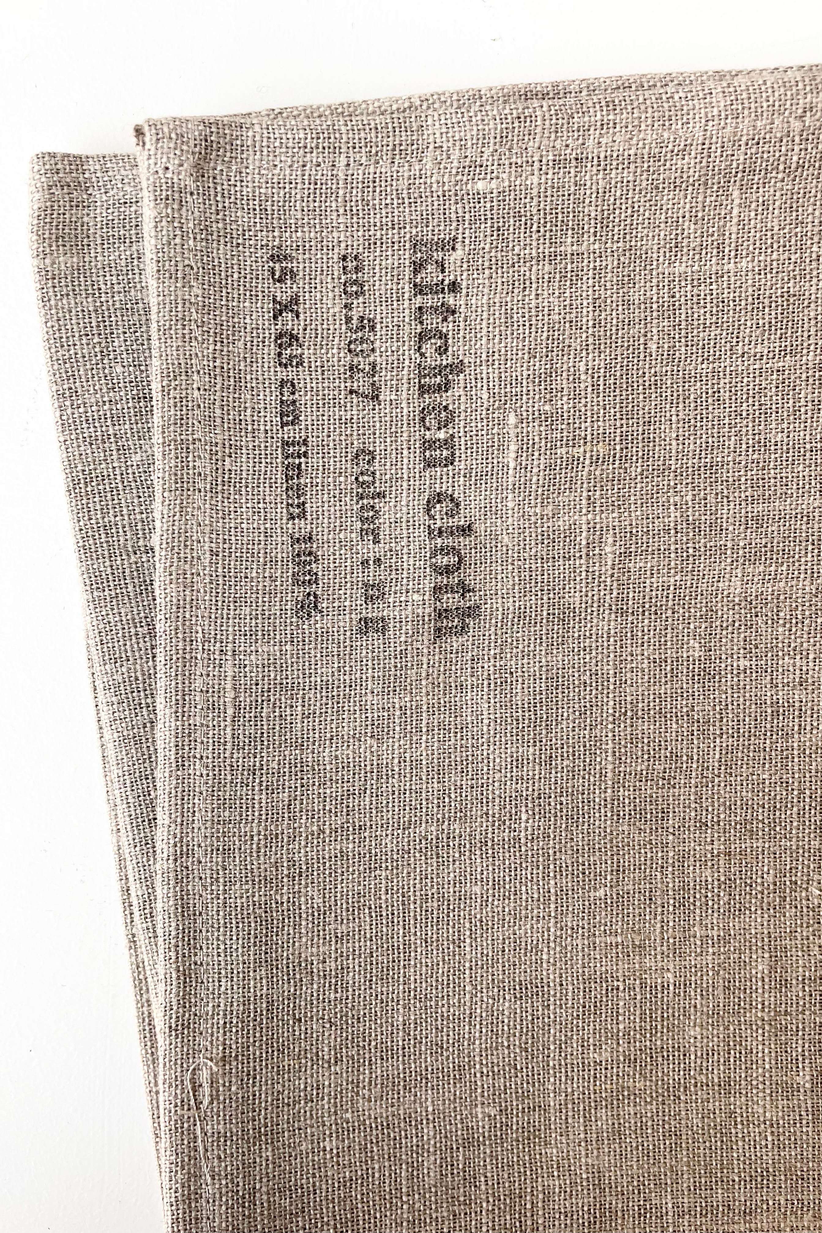 detail of Tablecloth linen natural large against a white wall