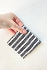 Jack Linen Coaster held against a white wall