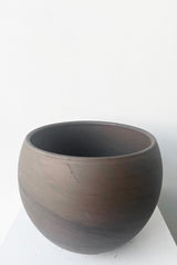 A slightly overhead view of Luna Sphere Pot basalt 7.75" against white backdrop