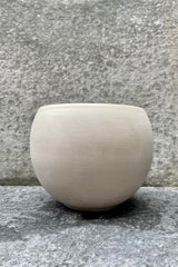 The 6.5 inch granite Luna Sphere Pot sits against a grey backdrop.