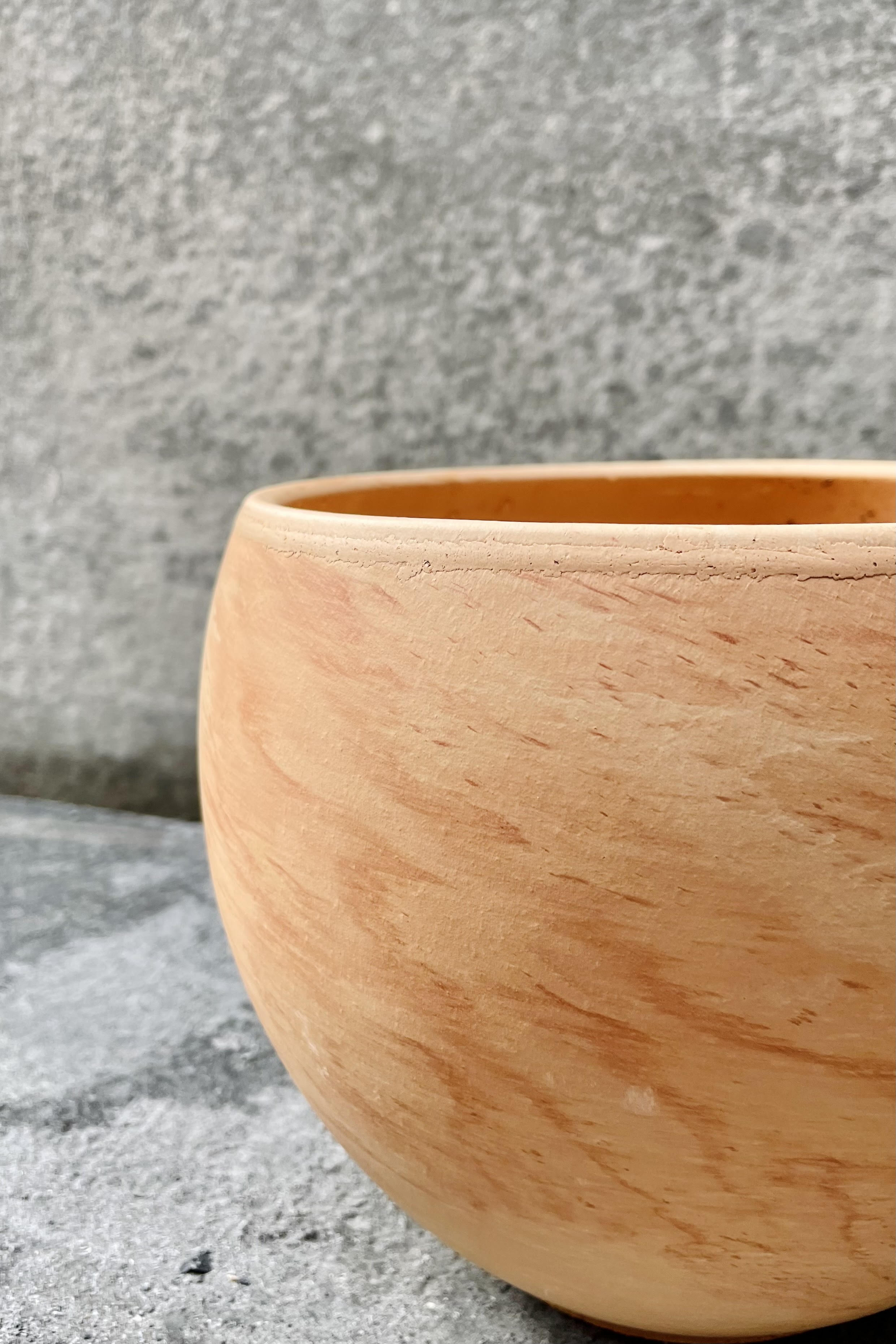 A detailed view of the 7.75 inch Luna Sphere Pot in light marble.