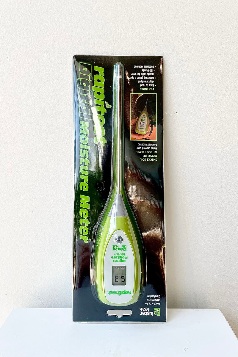 Luster Leaf Digital Moisture Meter with packaging against a white wall
