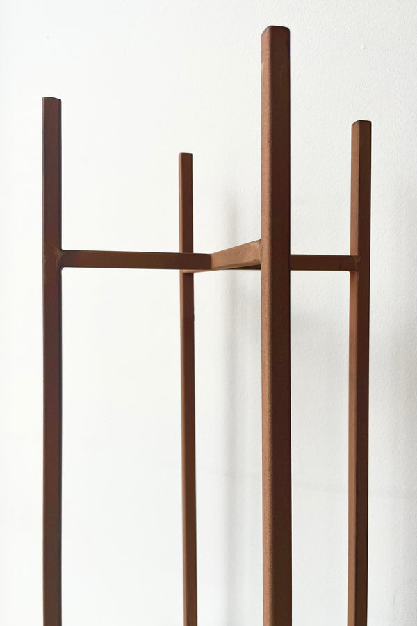 Ascot Plant Stand, Rust 9.45" detail against a white wall