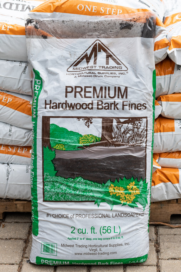 A bag of premium hardwood bark fine mulch in a 2 cubic foot size in the Sprout Home yard. 
