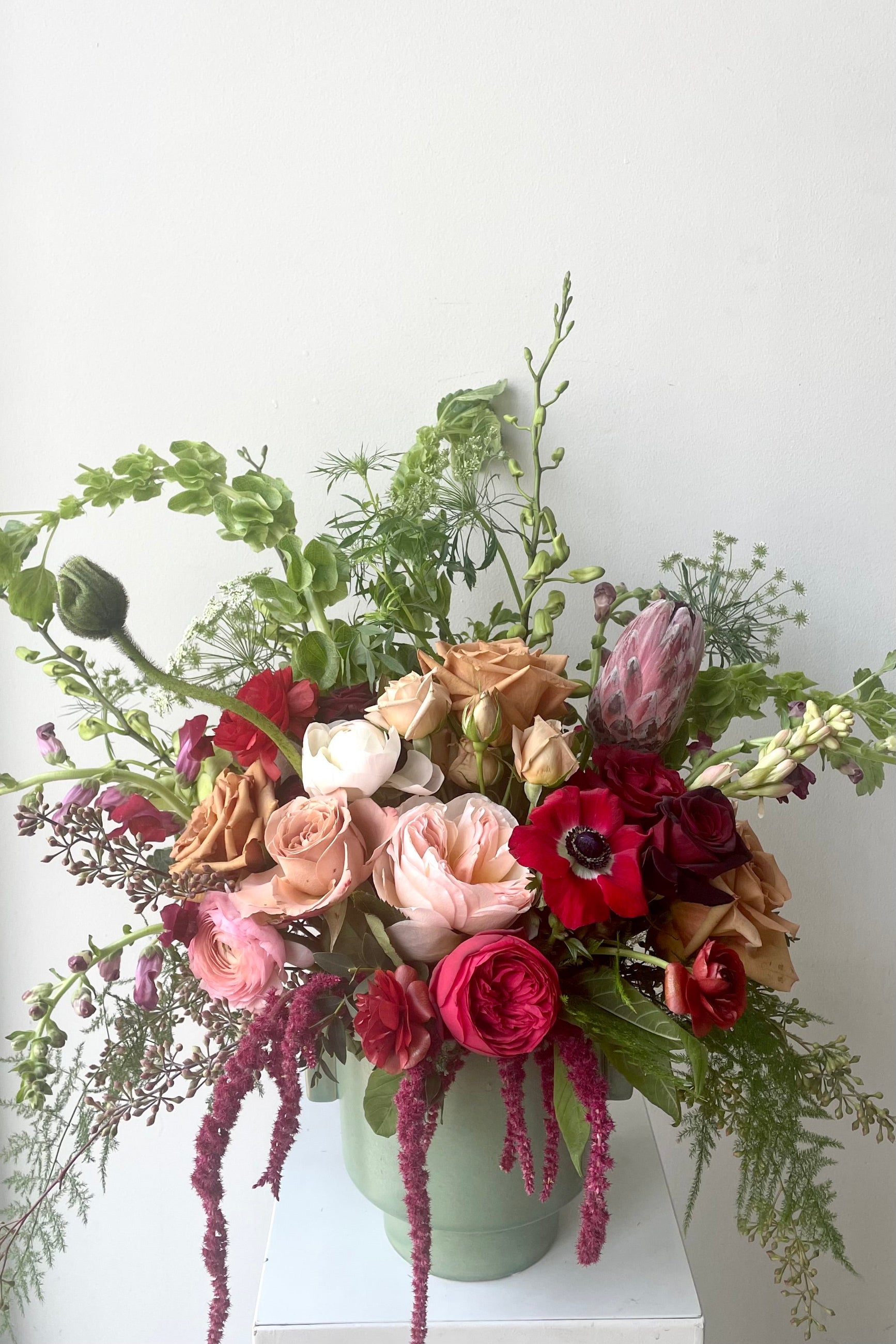 A vase holds an example of fresh Floral Arrangement Modern Love from Sprout Home Floral in Chicago for Valentine's Day  ©Sprout Home #size_$200