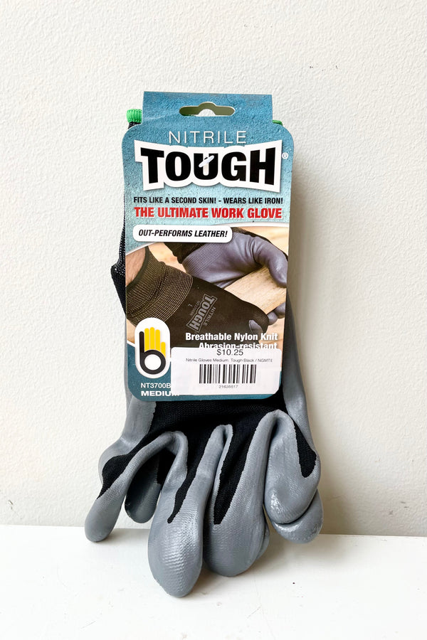 Nitrile Gloves Tough Black Medium against a white wall