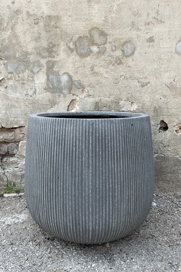 Pax Pot Vertical Ridged Dark Grey Large against a grey wall